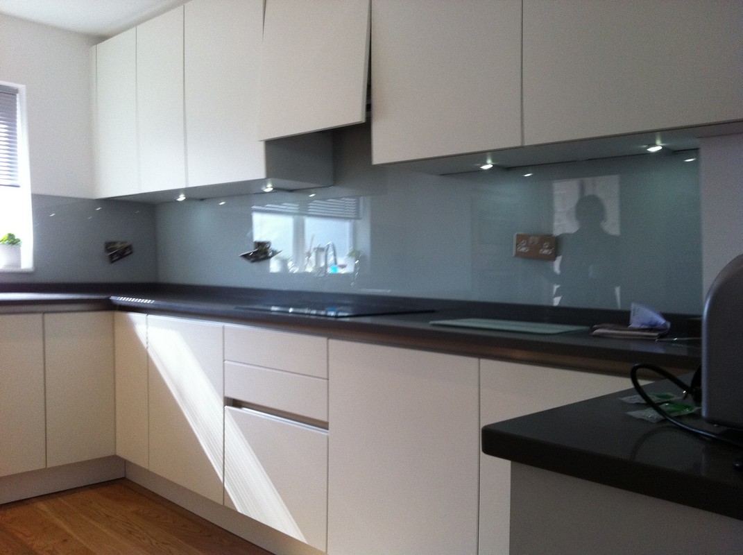 Grey glass kitchen splashback with LED lighting in Pinner