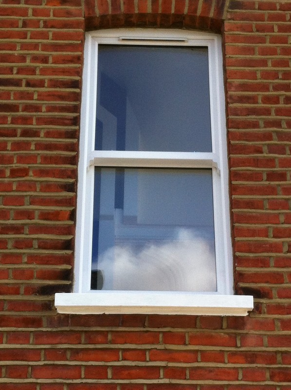 uPVC sash window on Victorian red brick house in Pinner